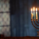 Happy Hanukkah Background with candlestick and copy space